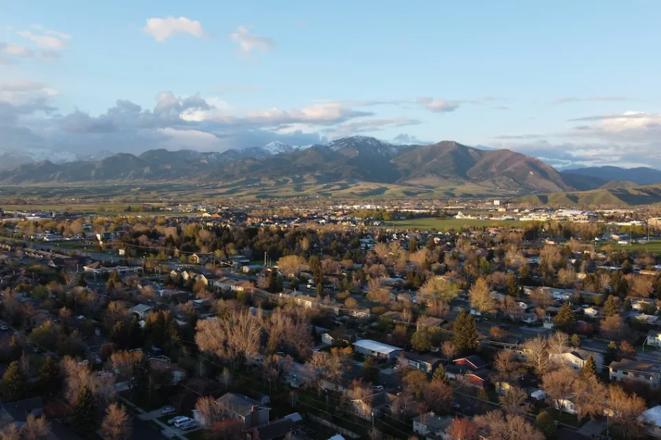 Aerial view of Bozeman, Montana with mountains in background.